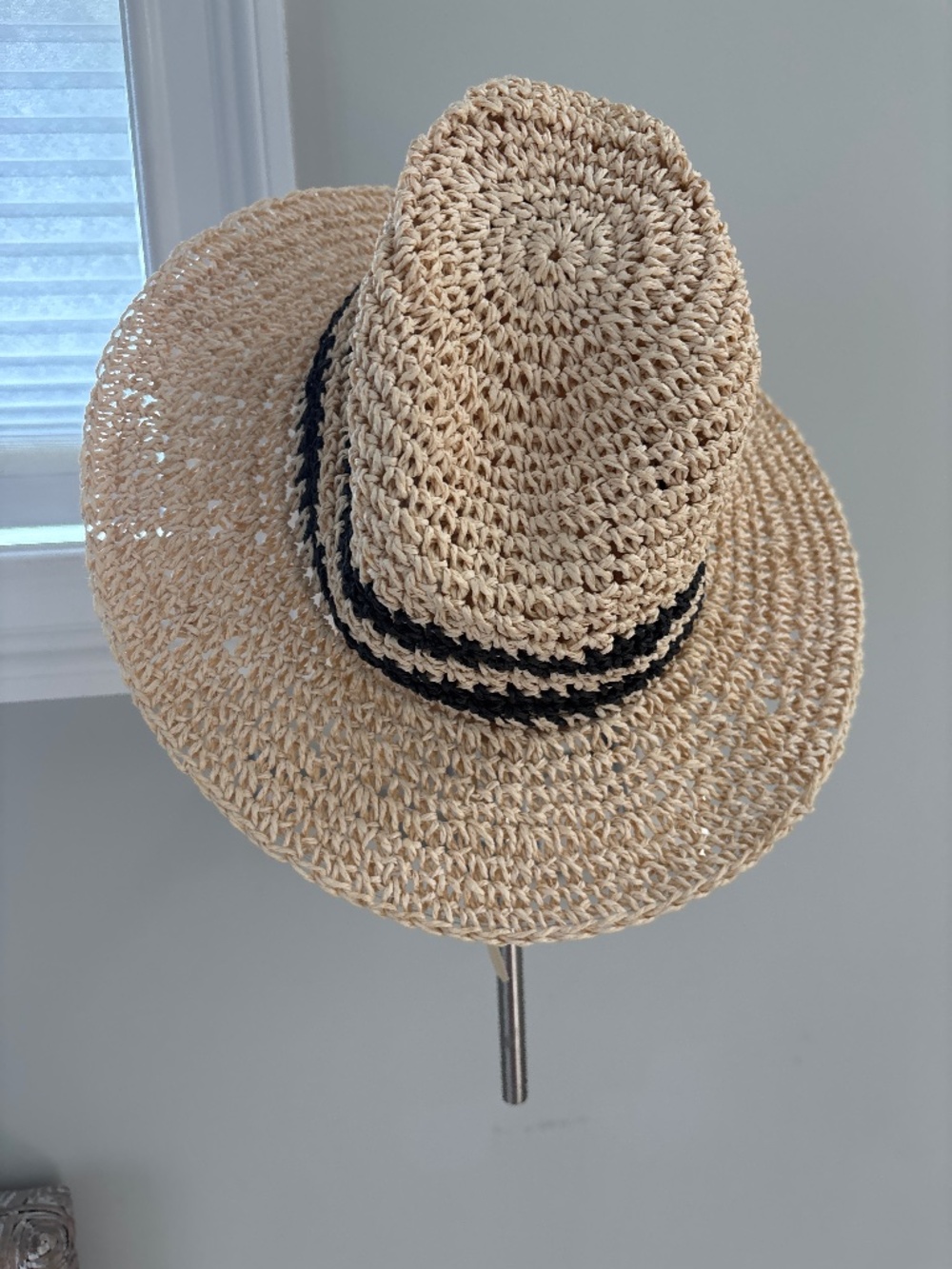 Straw hat with black trim